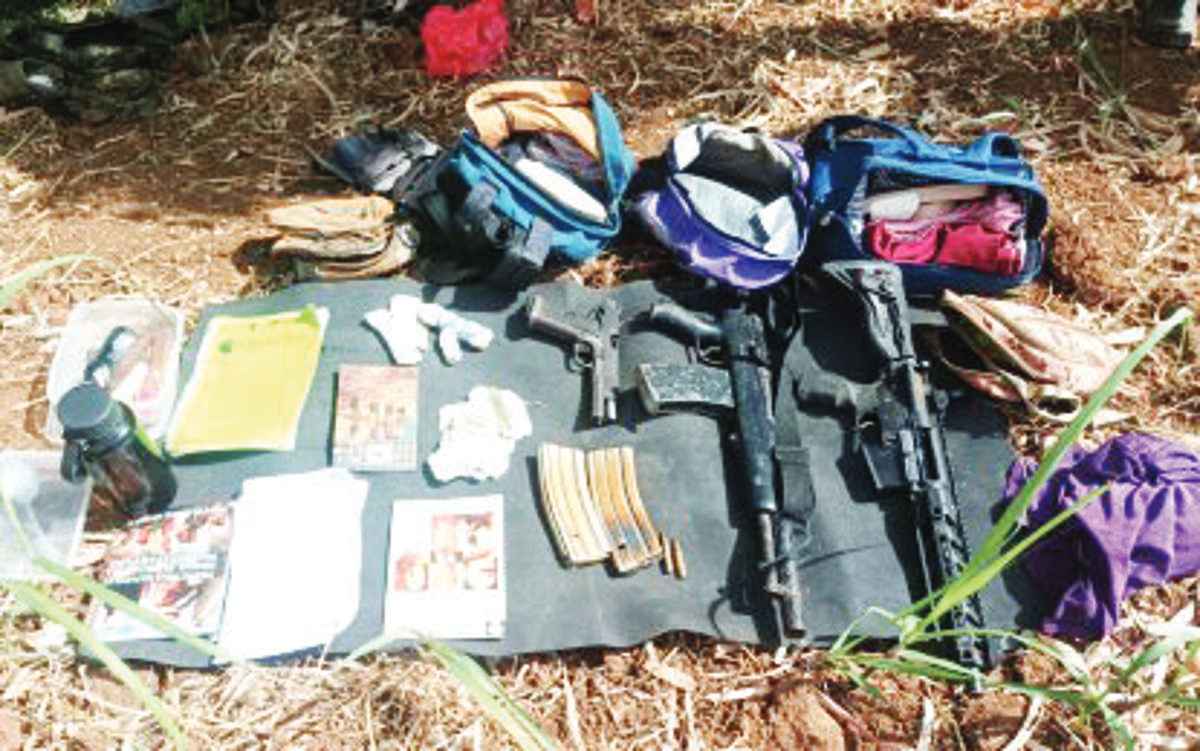 Weapons and other items were seized after an encounter with suspected members of the New People’s Army at Barangay Sag-ang in Negros Occidental’s La Castellana town yesterday, January 17, 2024. (62IB photo) 