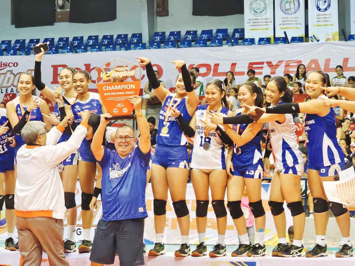 The Bacolod Tay Tung High School Thunderbolts celebrate their Rebisco Volleyball League National Finals championship. (Jose Montalbo photo)