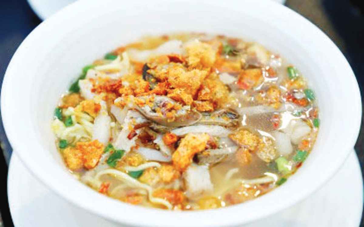 La Paz Batchoy, a prominent noodle soup dish from La Paz, Iloilo City, is composed of savory meat stock, pork organs, and chicharon, among others. Iloilo City is now in a festive mood amid the 2024 Dinagyang Festival highlights until January 28, 2024. Local and foreign tourists can partake of Ilonggo delicacies during the food festival, one of the events for the celebration. (DOT photo)