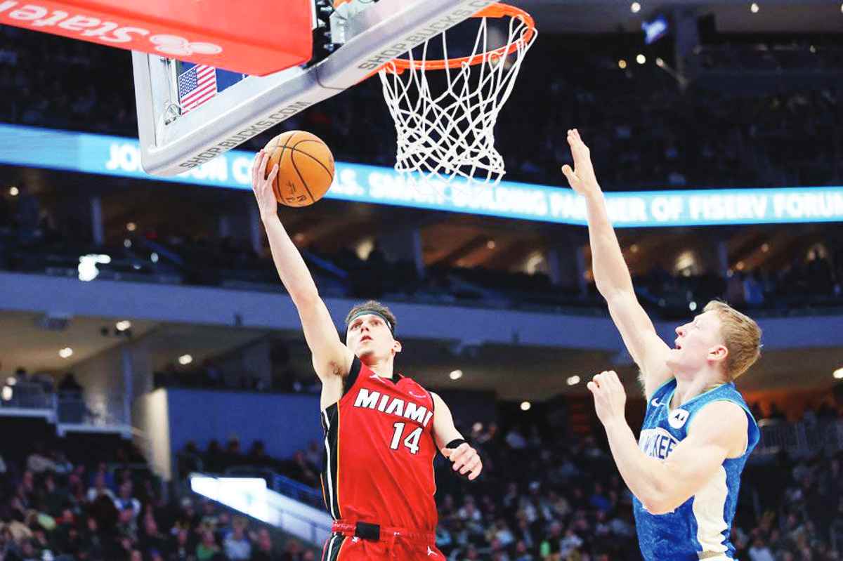 Tyler Herro (left) of the Miami Heat drives to the basket against AJ Green of the Milwaukee Bucks at Fiserv Forum in Milwaukee, Wisconsin. (Stacy Revere / Getty Images via AFP)