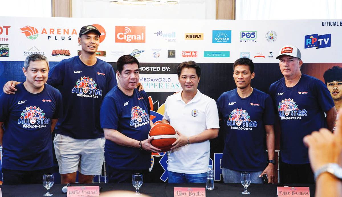 PBA Commissioner Willie Marcial hands a ball to Bacolod City Mayor Alfredo Abelardo Benitez during a press conference on Thursday afternoon, March 21, 2024. (PBA photo) 