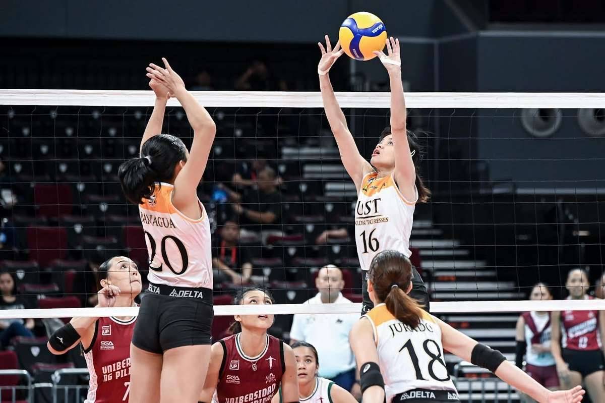 Negrense Cassie Carballo of the University of Santo Tomas Golden Tigresses tosses the ball to her teammates. (UAAP photo)