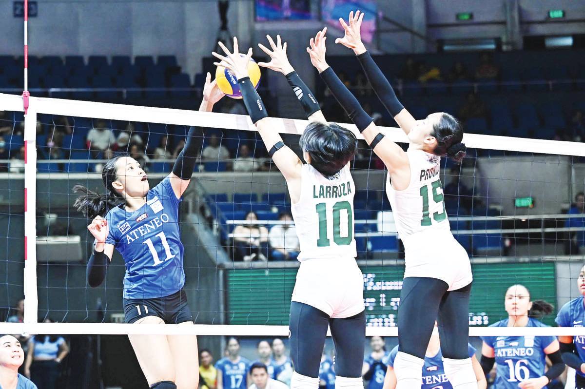 Negrense Maicah Larroza of the De La Salle University Lady Spikers blocks the attack of Ateneo de Manila University Blue Eagles' Zel Tsunashima. (UAAP photo)