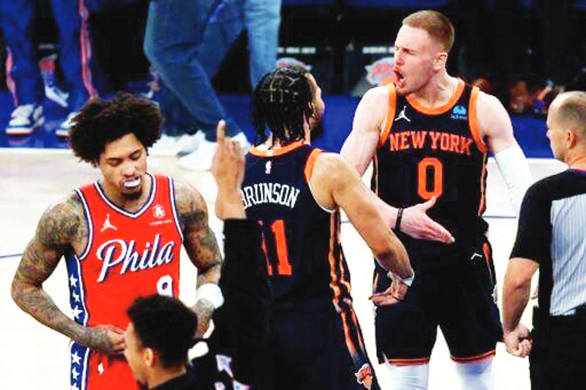 Donte DiVincenzo and Jalen Brunson of the New York Knicks celebrate late in the Knicks' victory over the Philadelphia 76ers in Game 2 of their NBA Eastern Conference first-round series. (Sarah Stier photo)