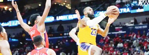 LeBron James, Lakers edge Pelicans, clinch playoff bid