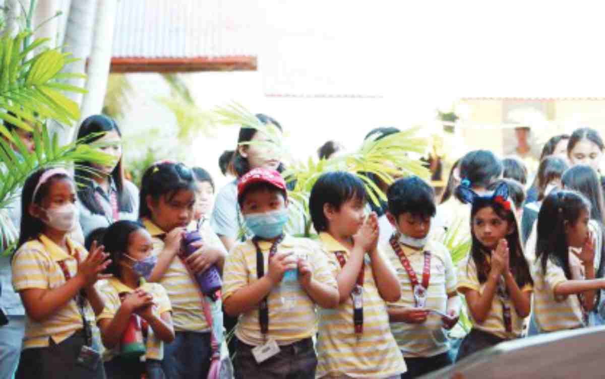 Learners of the Foundation University Preparatory Academy in Dumaguete City, Negros Oriental, pray silently during a recent activity on campus in this undated photo. Residents in this provincial capital are opposing the proposed establishment of a casino, saying students would be affected by the ill effects of gambling. (Lupad Dumaguete / Facebook photo)