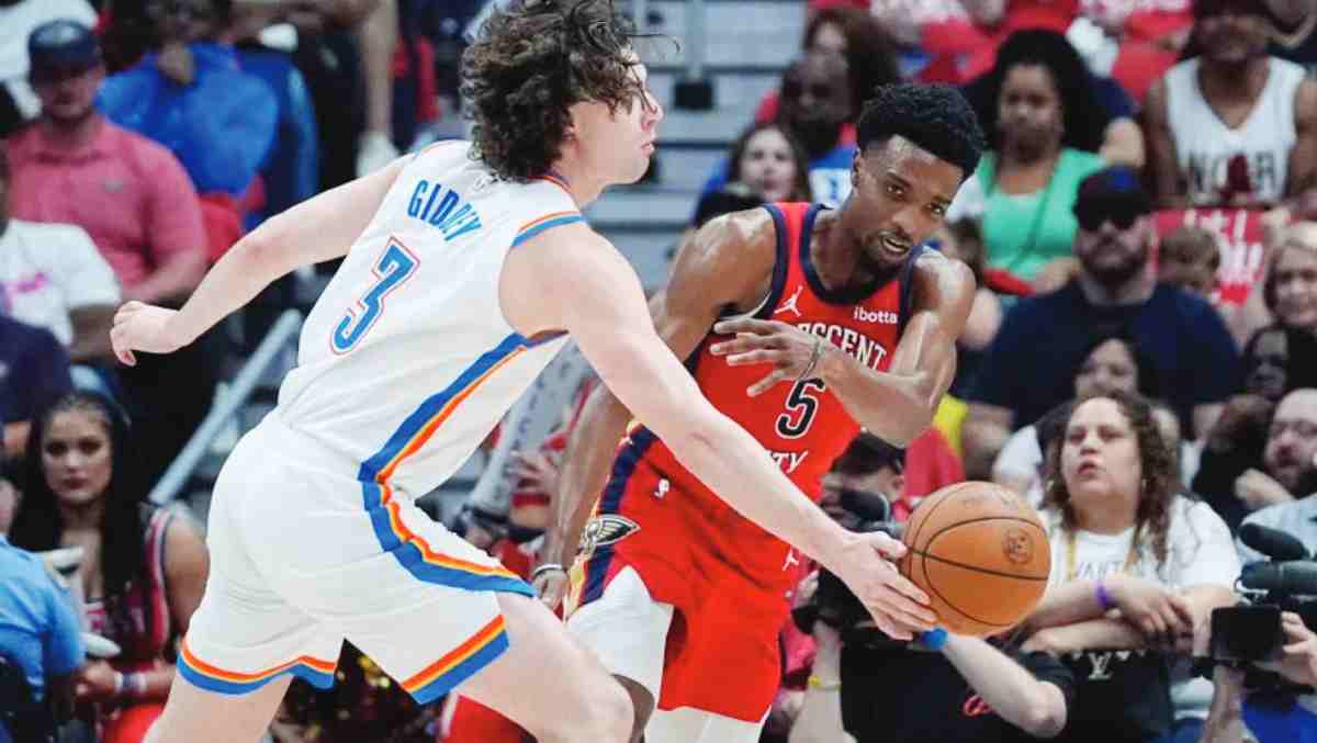 Oklahoma City Thunder guard Josh Giddey (left) knocks away a pass by New Orleans Pelicans forward Herbert Jones in Game 3 of an NBA first-round playoff series. The Thunder won 106-85. (Gerald Herbert / AP photo)