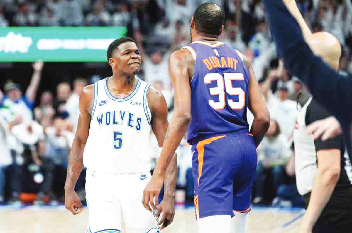 Minnesota Timberwolves guard Anthony Edwards (left) celebrates towards Phoenix Suns forward Kevin Durant after making a three-point shot during Game 1 of an NBA first-round playoff series. (Abbie Parr / AP photo)