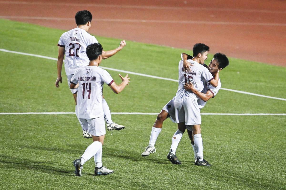 The University of the Philippines Fighting Maroons celebrate Cian Galsim's goal against Ateneo de Manila University in the UAAP Season 86 men's football tournament on Thursday, April 18, 2024. (UAAP Media photo)