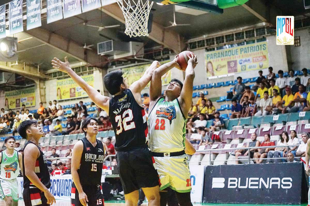 Bacolod City of Smiles’ JM Manalang hacks Zamboanga City Family Sardines’ Joseph Gabayni. (MPBL photo)