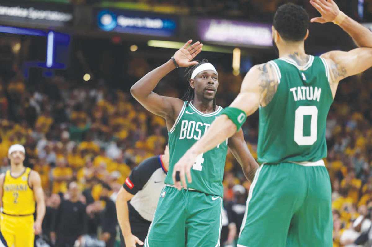 Jrue Holiday (left) celebrates with teammate Jayson Tatum during the Boston Celtics' Game 4 win against the Indiana Pacers in the NBA Eastern Conference finals.