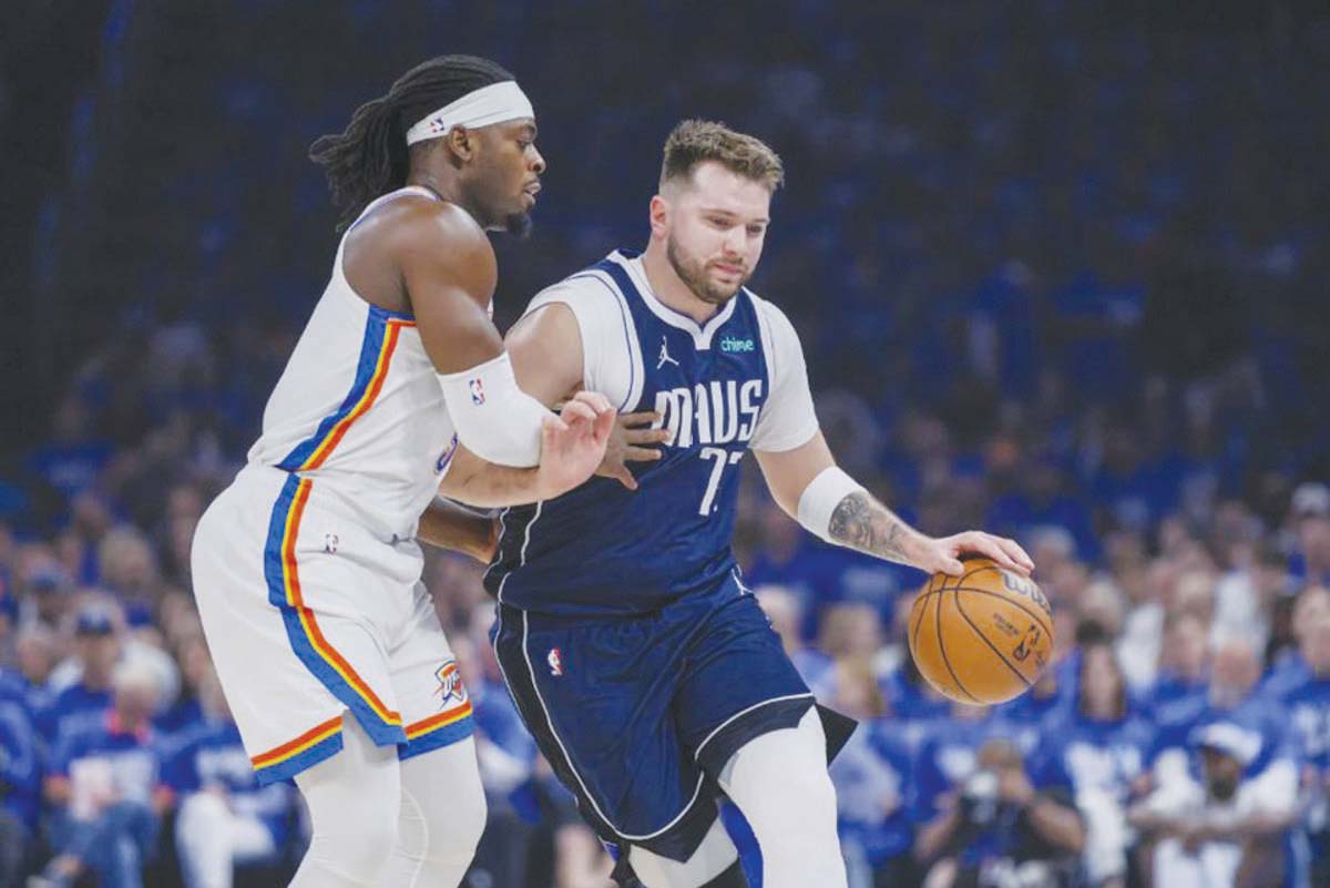 Dallas Mavericks guard Luka Doncic (right) drives against Oklahoma City Thunder's Luguentz Dort during Game 1 of an NBA second-round playoff series. (Nate Billings / AP photo)