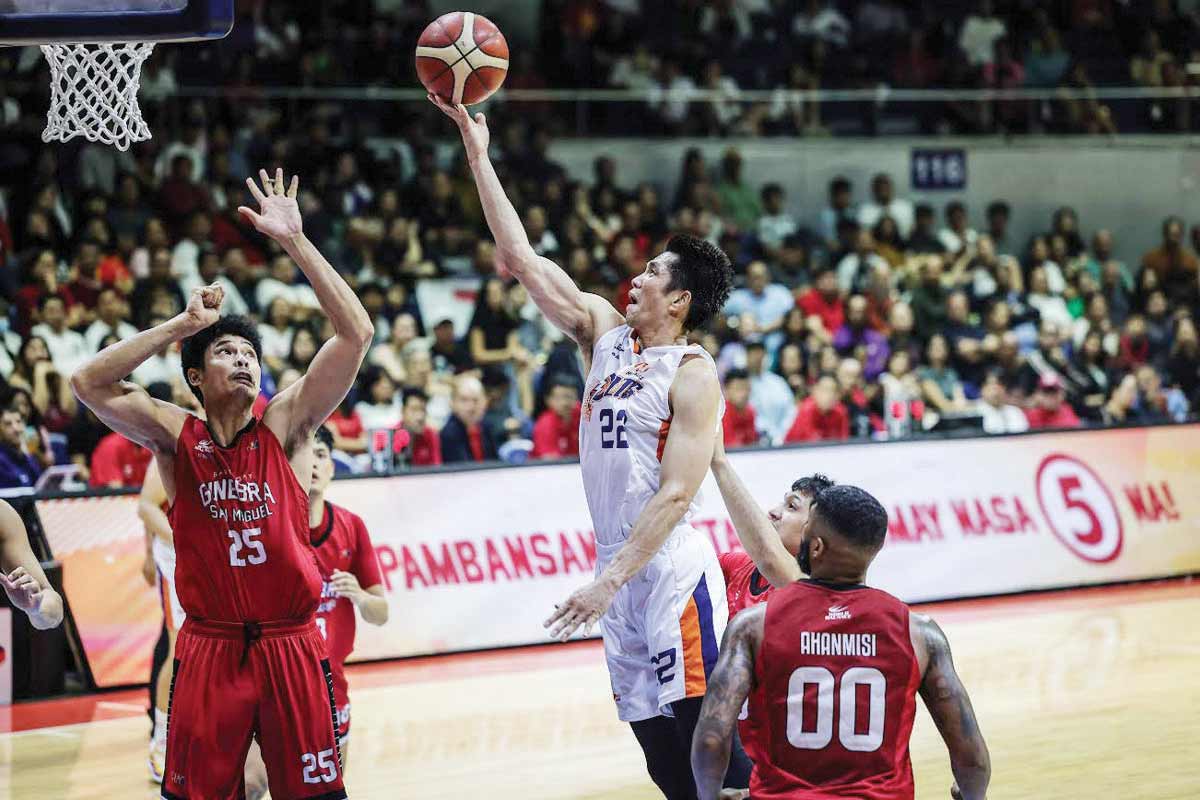 Meralco Bolts’ Allein Maliksi scoops for a layup against the defense of Barangay Ginebra San Miguel Kings’ Japeth Aguilar. (PBA photo)