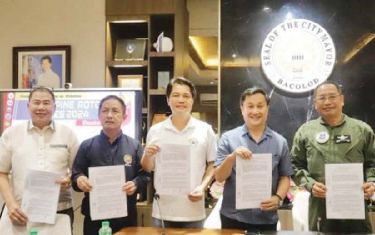 Bacolod City Mayor Alfredo Abelardo Benitez (center) with Senator Francis Tolentino (second from right) and Philippine Air Force Reserve Commander Major General Elpidio Talja show the signed memorandum of agreement for hosting the ROTC Games 2024 Visayas Regional Qualifying Leg from May 26 to June 1. They are joined by (from left) Carlos Hilado Memorial State University president Norberto Mangulabnan and CHED-Western Regional Director Raul Alvarez. (Philippine ROTC Games / Facebook photo)