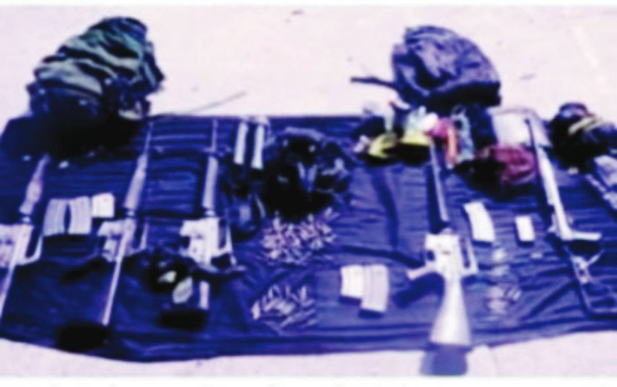 The high-powered firearms and ammunition seized by troops of the Philippine Army’s 94th Infantry Battalion after an encounter with New People’s Army remnants in the hinterlands of Kabankalan City, Negros Occidental on Monday afternoon, May 6, 2024. The troops responded to reports from residents of Sitio Tagok, Barangay Carol-an about the continued extortion activities of armed rebels. (94th Infantry Battalion / Philippine Army photo)