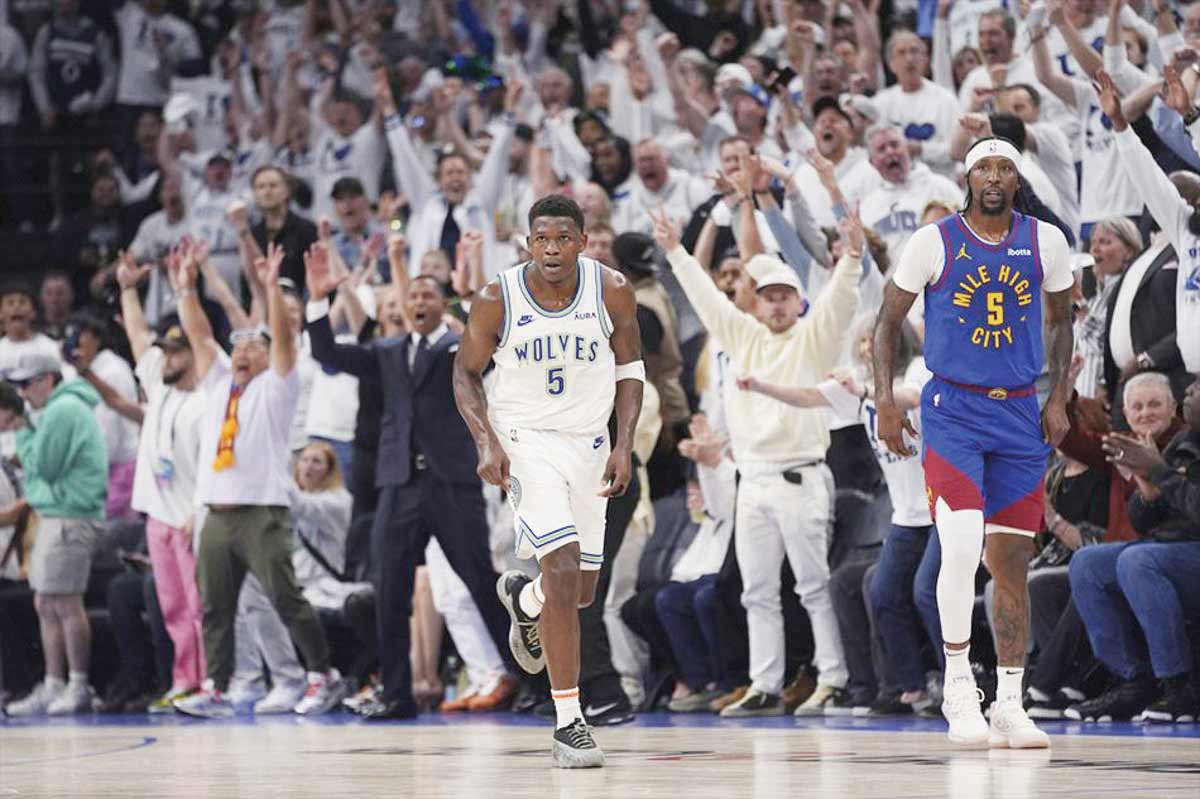 Minnesota Timberwolves guard Anthony Edwards runs down the court after making a three-point shot against the Denver Nuggets during Game 6 of an NBA second-round playoff series. (Abbie Parr / AP photo)