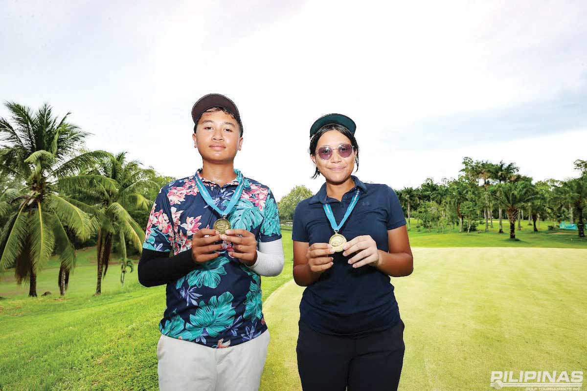 Nyito Tiongko and Tiffany Bernardino hold their medals after topping their respective sides in the 13-15 age category of the ICTSI-Junior Philippine Golf Tour Visayas series in Bacolod City. (Contributed photo)
