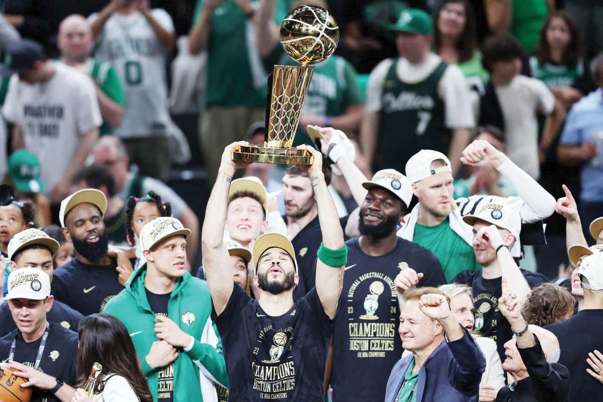 Jayson Tatum of the Boston Celtics lifts the Larry O’Brien Championship Trophy after their 106-88 win against the Dallas Mavericks in Game 5 of the 2024 NBA finals. (Adam Glanzman / Getty Images / AFP photo)