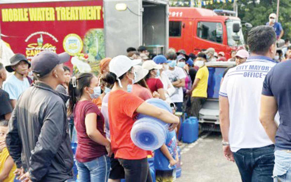 Residents of Canlaon City, Negros Oriental line up at a portable/mobile water filtration system to access safe drinking water in this undated photo. Following the June 3, 2024 eruption of Mt. Kanlaon, water sources in the mountain city may have been compromised by the presence of hazardous sulfur dioxide. (Salta Canlaon / Facebook photo)  