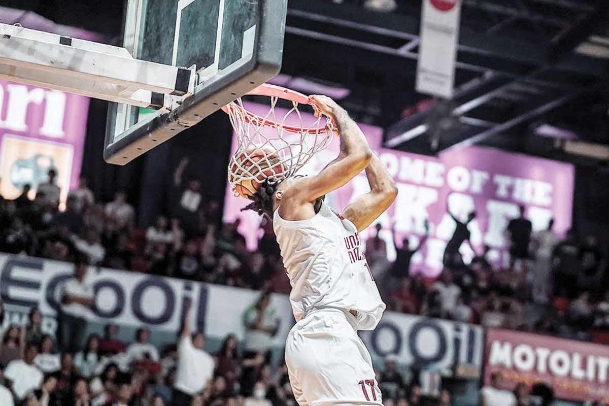 University of the Philippines Fighting Maroons’ Francis Lopez goes for a reverse dunk. (FilOil Sports photo)