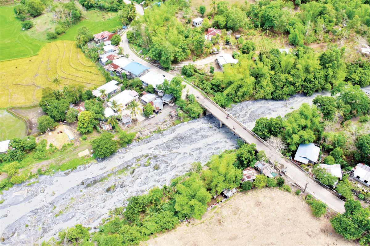 Photo shows a community affected by a lahar flow following the eruption of Kanlaon Volcano. The Philippine Air Force and the Philippine Army earlier this week conducted aerial assessment of farmlands, rivers and communities affected by lahar flows. (Negros Occidental provincial government photo)