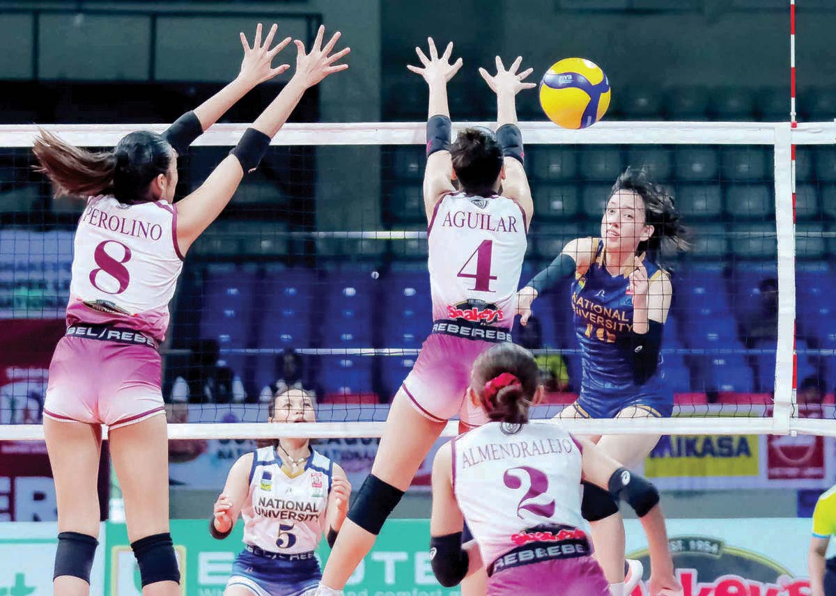 Negrense Celine Marsh of the National University Lady Bulldogs scores against an Enderun Colleges Titans defender. (SSL photo) 