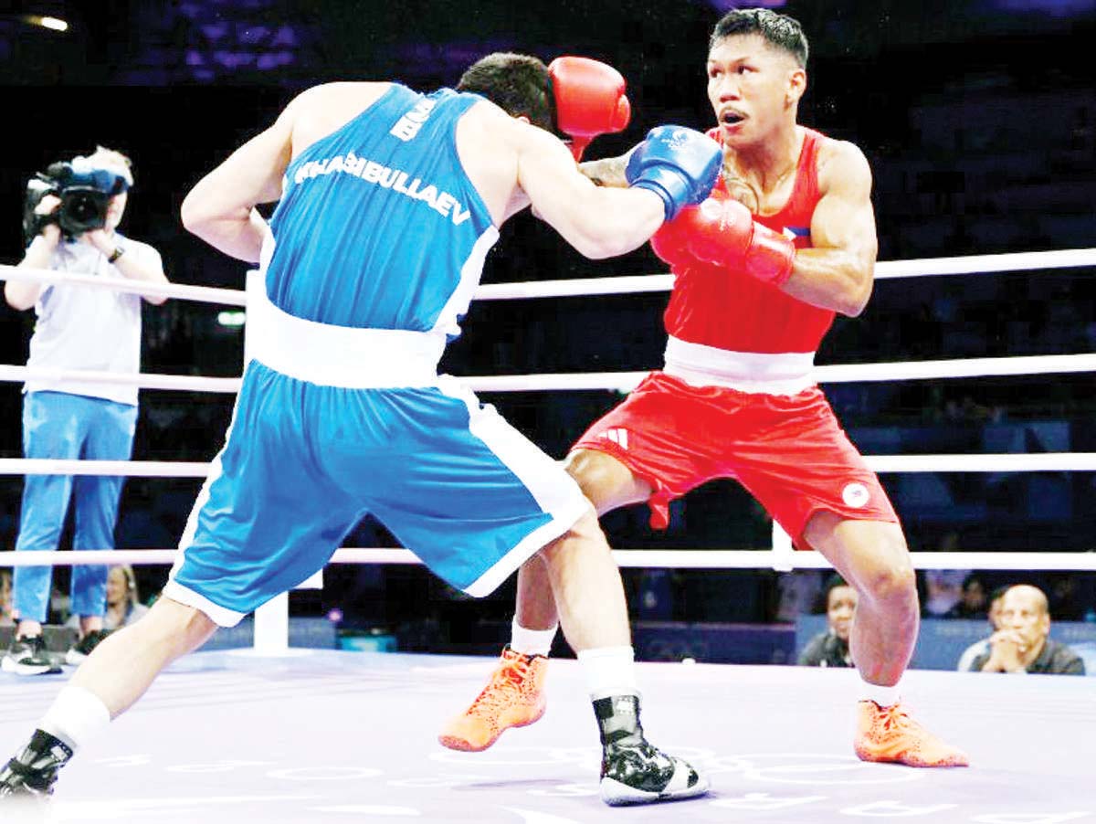 Philippines' Eumir Felix Marcial (right) connects with a punch on Uzbekistan's Turabek Khabibullaev in the men's 80-kilogram preliminaries round-of-16 boxing match during the Paris 2024 Olympic Games at the North Paris Arena in Villepinte. (Mohd Rasfan / AFP photo)