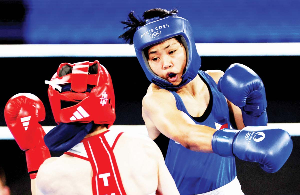 Aira Villegas of the Philippines in action against Buse Naz Cakiroglu of Turkey. (Maye-e Wong / Reuters photo)