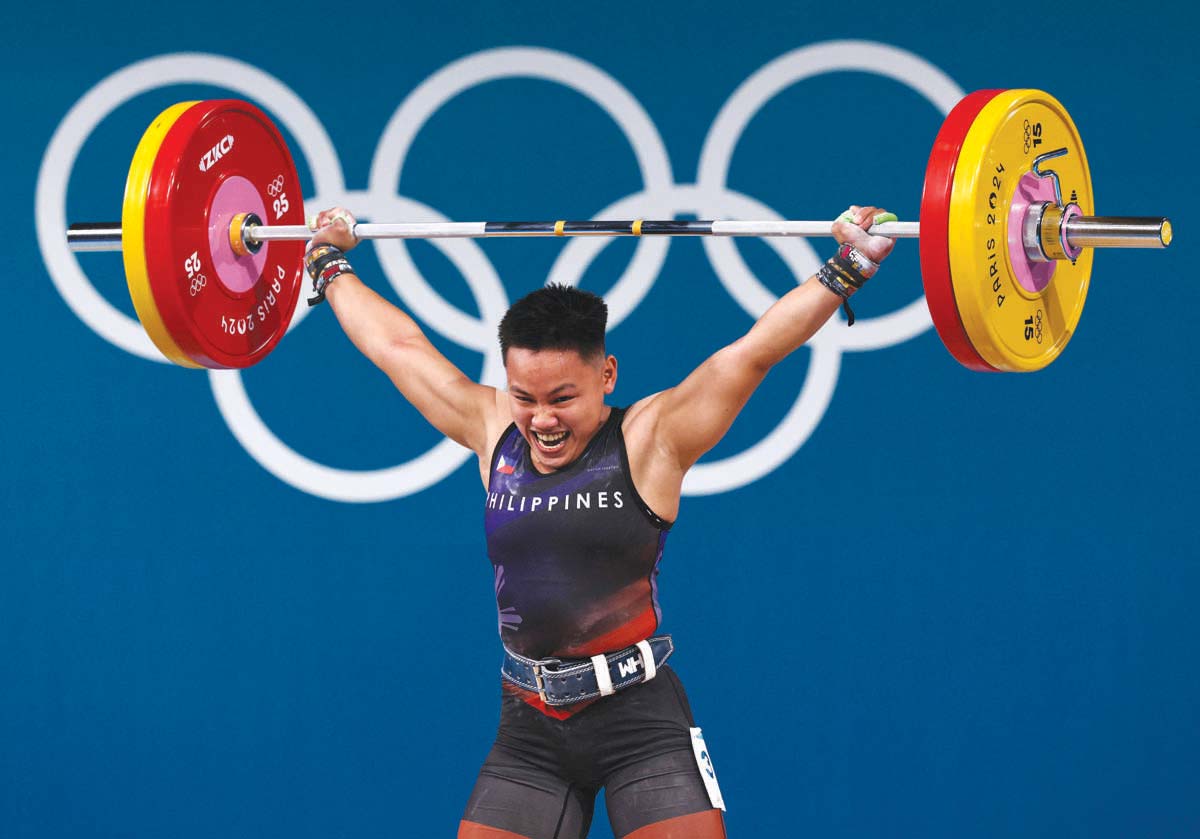 The Philippines' Elreen Ann Ando competes in the women's 59-kilogram weightlifting event during the 2024 Paris Olympic Games at the South Paris Arena on Thursday, August 8, 2024. (Miguel Medina / AFP photo)