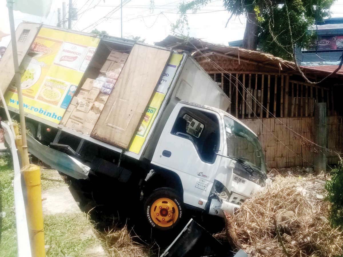 A delivery van loaded with boxes of instant noodles hit the waiting shed, where the victim took a rest after a morning jog. (dyHB RMN Bacolod photo)