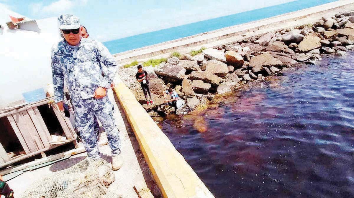 A molasses spill from M/T Mary Queen of Charity caused the discoloration of waters along the feeder port in Negros Occidental’s Sagay City on August 7, 2024. (Sagay City Information and Tourism Office photo)