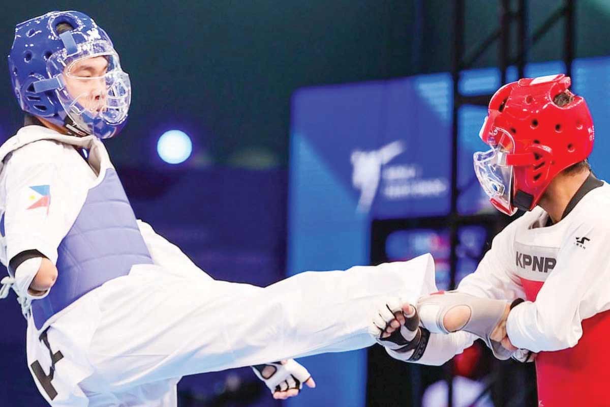 National para taekwondo jin Allain Ganapin (left) in action during the Asian Olympic and Paralympic Taekwondo qualifying meet in Taiyang, China last March 2024. (Facebook / File photo)