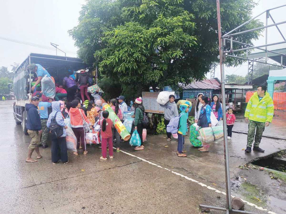 More than 2,000 residents living within Kanlaon Volcano's four-kilometer permanent danger zone in Negros Occidental’s La Castellana town evacuated following the volcano’s unrest and the inclement weather due to monsoon rains, the Provincial Disaster Risk Reduction and Management Council says. (La Castellana PNP photo)