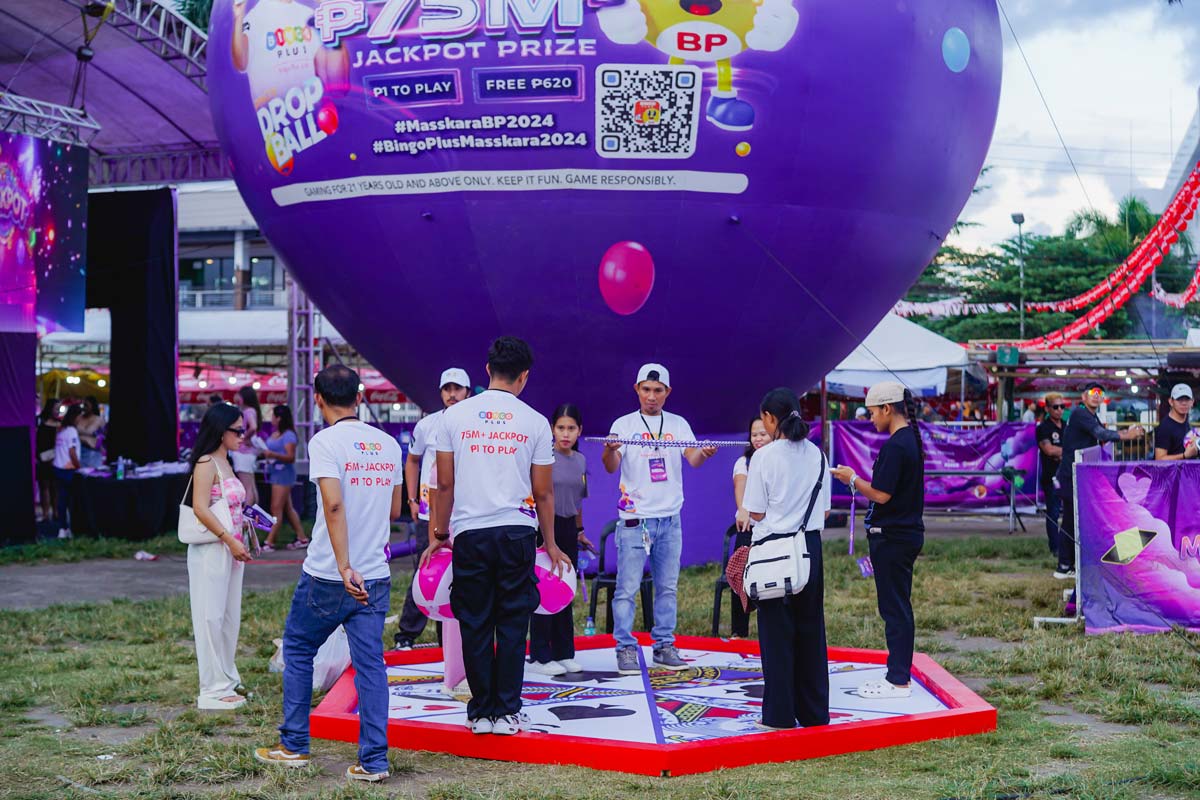 Players enjoying the live-action Pinoy Drop Ball game at the BP Day MassKara Music Festival