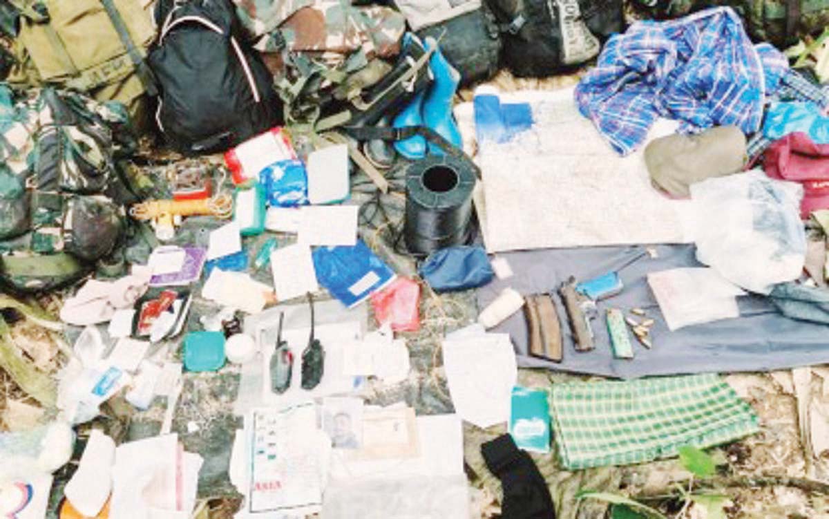 The weapons and other items recovered by troops of the Philippine Army’s 15th Infantry Battalion in the hideout of the New People’s Army remnants after a clash at Sitio Soso, Barangay Gatuslao in Candoni, Negros Occidental on November 22, 2024. Eight insurgents died during the series of gun battles on November 21 and 22, the military said. (15th Infantry Battalion / Philippine Army photo)