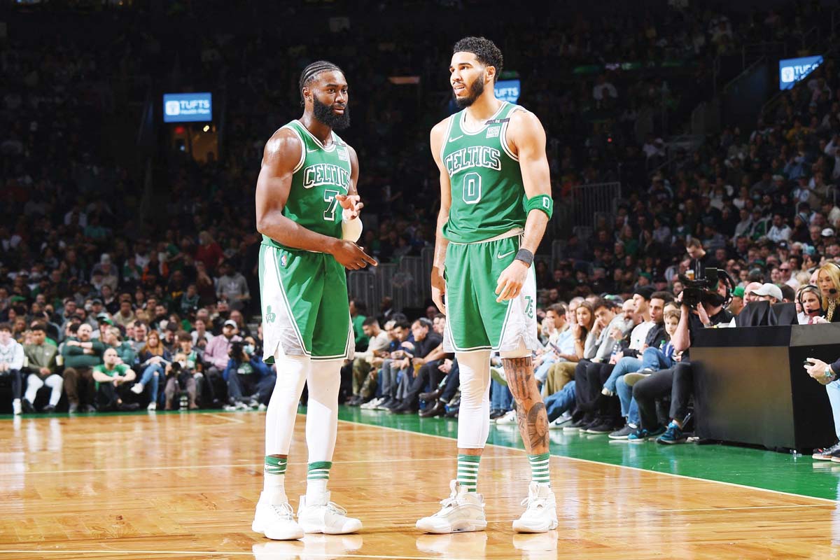 Jaylen Brown (left) and Jayson Tatum of the Boston Celtics talk during an NBA game against the Boston Celtics. (Brian Babineau / NBAE via Getty Images / AFP photo)