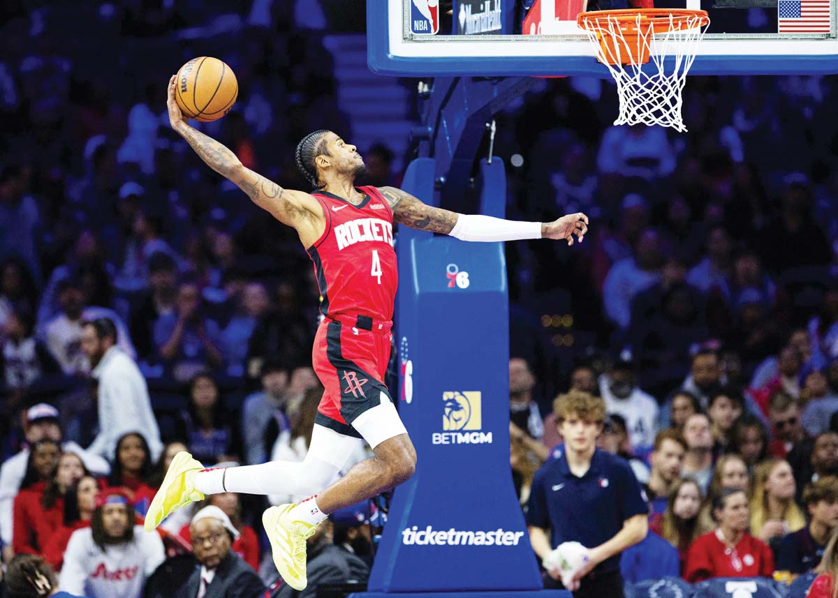 Houston Rockets guard Jalen Green drives for a dunk against the Philadelphia 76ers during the first quarter of an NBA game. (Bill Streicher-Imagn Images / Reuters photo)