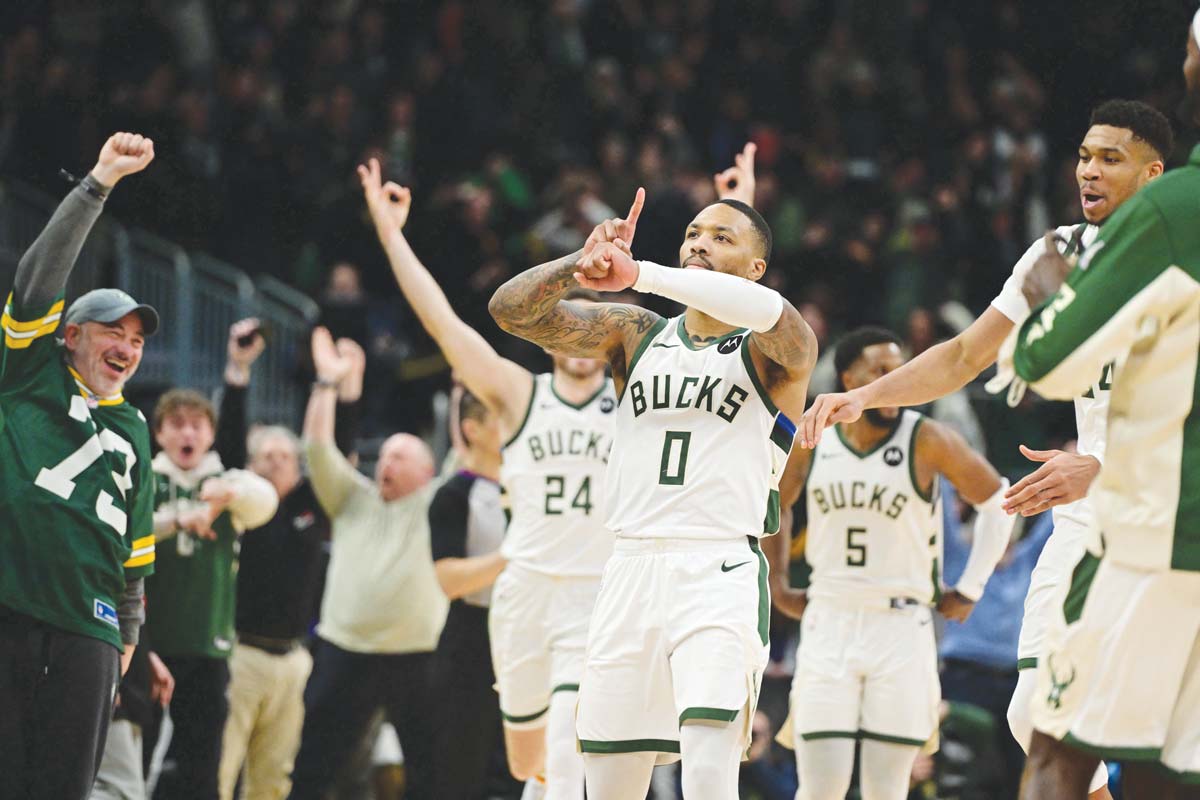 Milwaukee Bucks guard Damian Lillard reacts after scoring the game-winning basket in overtime against the Sacramento Kings in the NBA. (Benny Sieu photo)