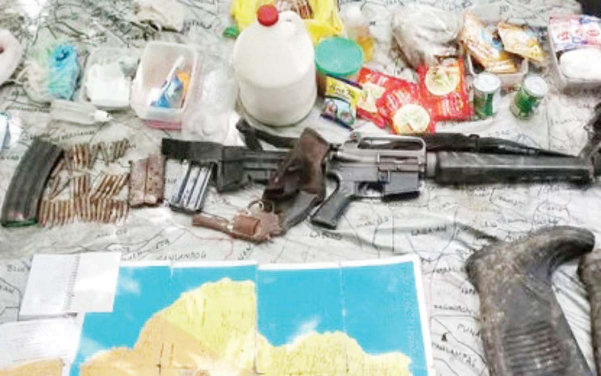 The weapons and other items recovered by troops of the Philippine Army’s 79th Infantry Battalion, following a clash with remnants of the dismantled New People’s Army (NPA)-North Negros Front in Barangay Bandila, Toboso, Negros Occidental on Friday, December 13, 2024. Alias “Pinky,” a cohort of NPA hitman Roger Fabillar was arrested during the pursuit operation. (79IB / Philippine Army photo)