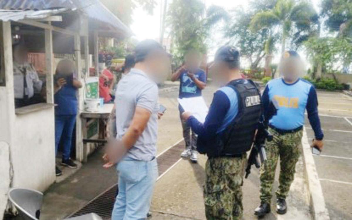 The arrest of Dharyl Albañez (left), accused of terrorism financing, in La Carlota City, Negros Occidental on January 2, 2024. He is one of the three facing terrorism financing charges before the Regional Trial Court Branch 31 in Iloilo City, arrested in the province on the same day. (Negros Occidental Police Provincial Office photo)