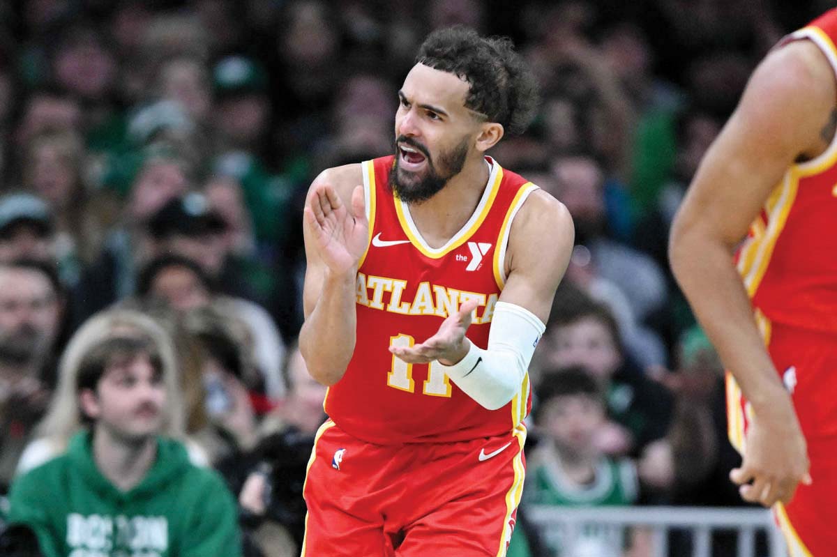 Atlanta Hawks guard Trae Young reacts after scoring against the Boston Celtics. (Brian Fluharty-Imagn Images / Reuters photo)