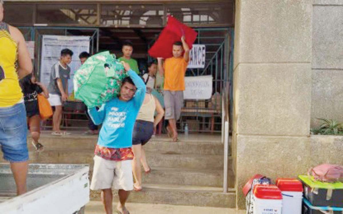 Evacuees are seen outside a government facility in Canlaon City, Negros Oriental in this undated photo. Civil defense officials say it is still unsafe for the more than 6,000 evacuees to return home due to the threat of a major eruption of Mt. Kanlaon. (Canlaon CIO photo)