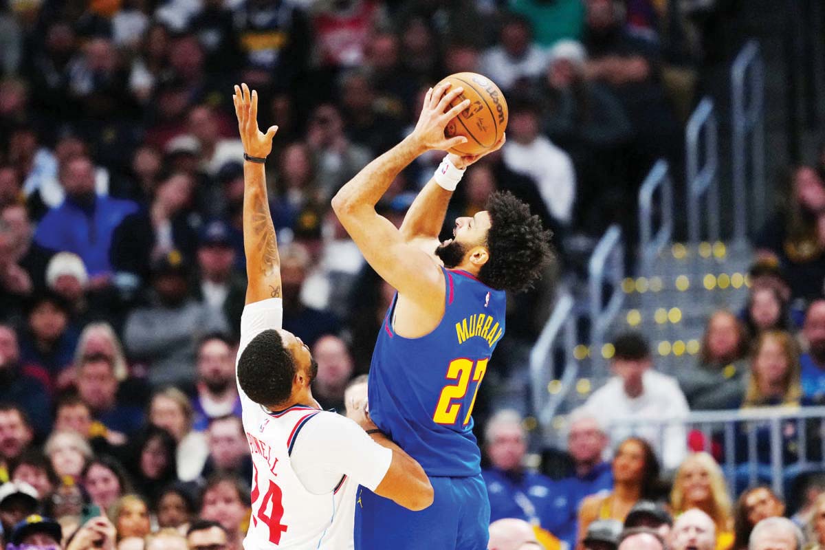 Denver Nuggets guard Jamal Murray (right) shoots over Los Angeles Clippers guard Norman Powell in the NBA. (Ron Chenoy-Imagn Images / Reuters photo)