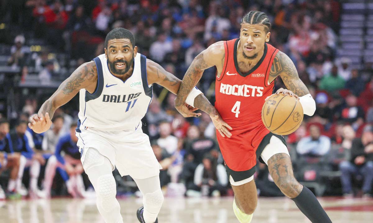 Houston Rockets guard Jalen Green (right) drives with the ball as Dallas Mavericks guard Kyrie Irving defends. (Troy Taormina-Imagn Images / Reuters photo)