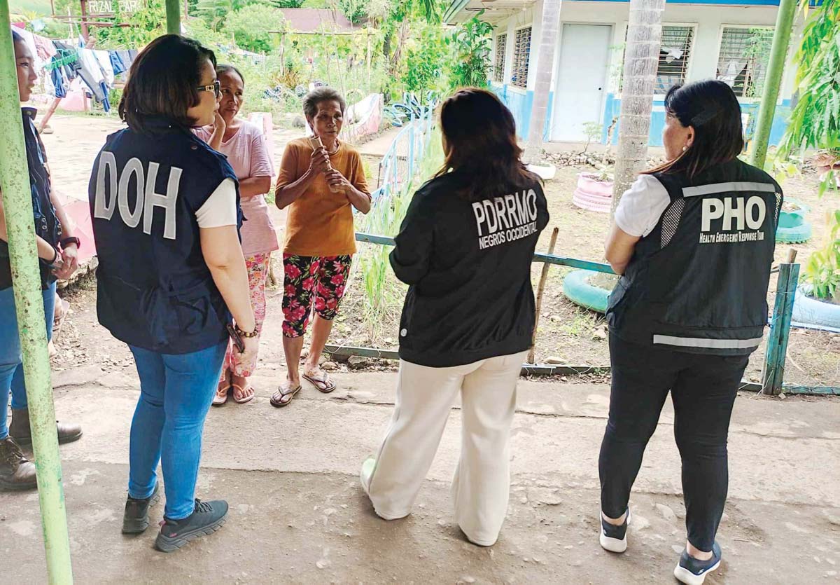 A team from the Department of Health, along with the Negros Occidental Provincial Health Office, reached out to the families and individuals affected by Kanlaon Volcano’s explosive eruption at various evacuation sites on December 30, 2024. (DOH-NIR Center for Health Development photo)