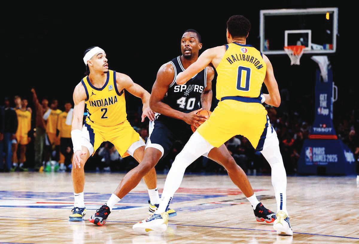 Harrison Barnes of the San Antonio Spurs in action against Tyrese Haliburton of the Indiana Pacers during their game at Accor Arena in Paris, France. (Stephanie Lecocq / Reuters photo)