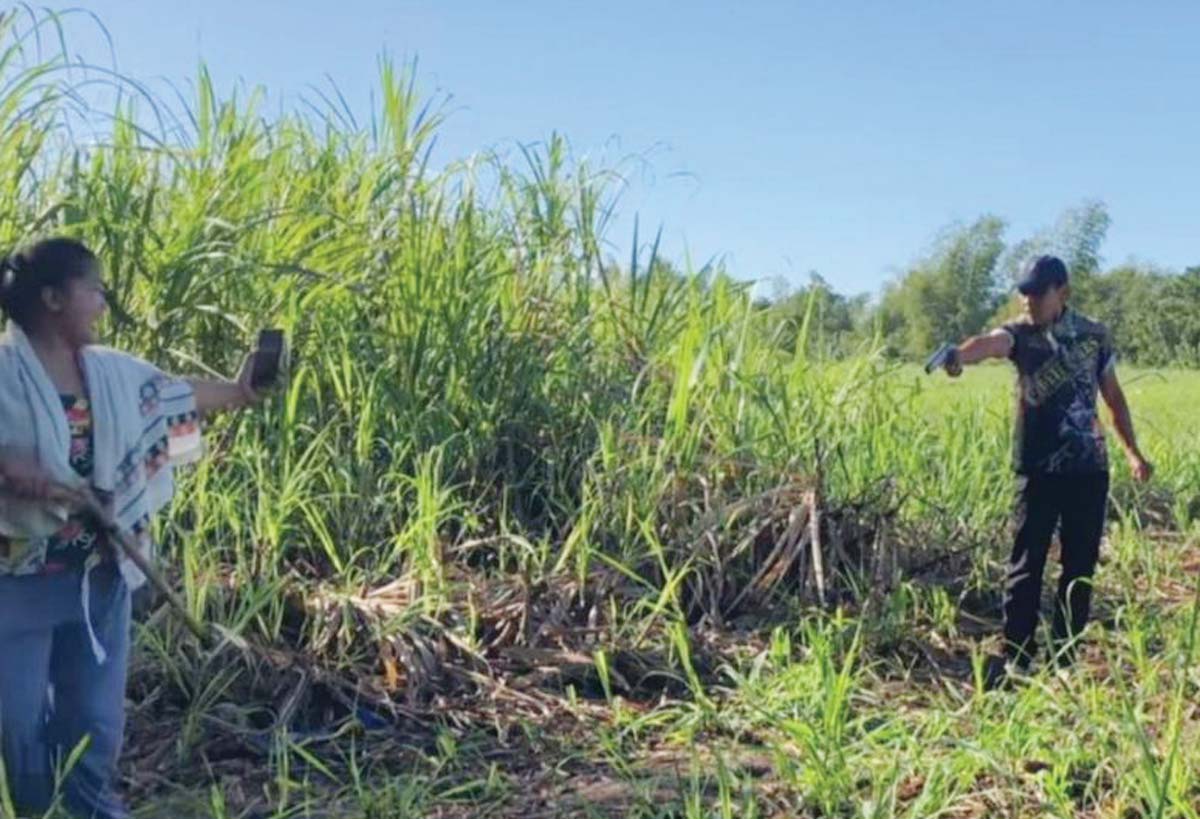 A video screengrab shows a man allegedly firing his gun at a woman as other agrarian reform beneficiaries shout during a land dispute on Friday, January 31, 2025. 