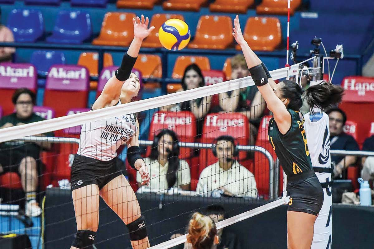 Negrense Joan Marie Monares of the University of the Philippines Fighting Maroons spikes the ball towards the Far Eastern University Lady Tamaraws’ defense. (UAAP photo)