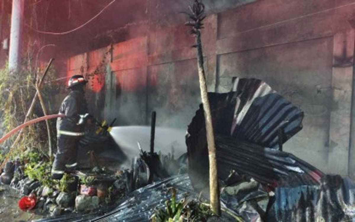 A Bureau of Fire Protection personnel responds to a residential fire in Bacolod City in this undated photo. As of yesterday, March 21, 2025, there are 284 sub-villages considered as red zones or fire-prone. (BFP-Bacolod City Fire Station photo)