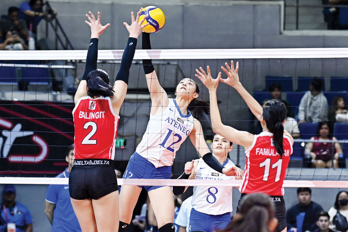 Negrense Jihan Chuatico of the Ateneo de Manila University Blue Eagles scores against the defense of Kayce Balingit of the University of the East Lady Warriors. (UAAP photo)